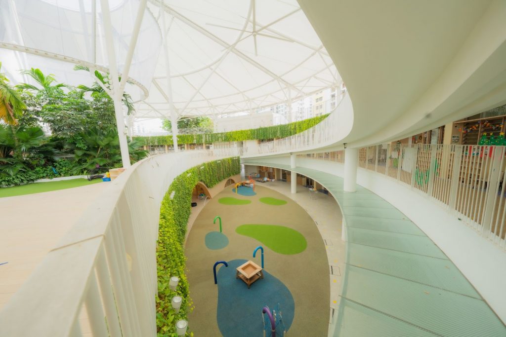 The preschool has water play areas for different developmental age groups.