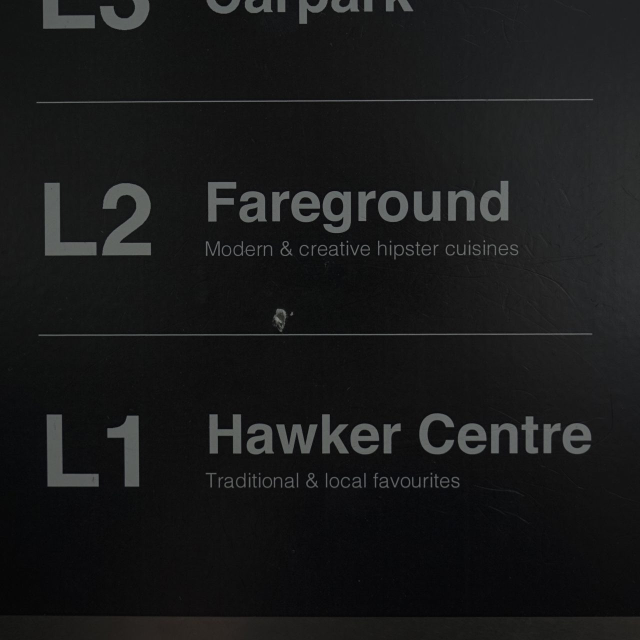 Directions in the lift in Pasir Ris Central Hawker Centre.