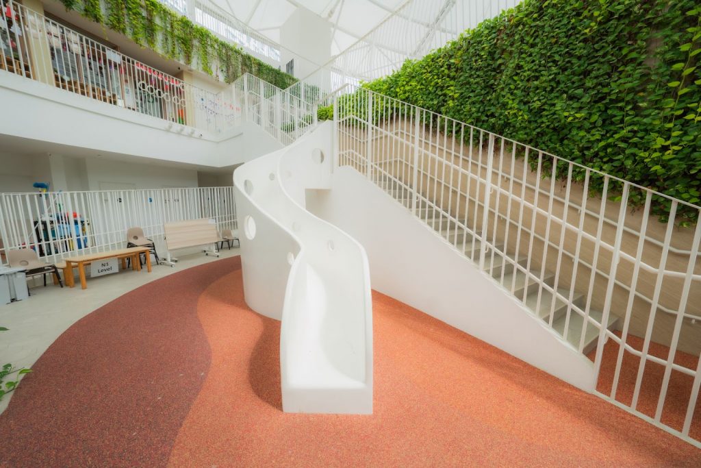 A slide located near the main entrance of the preschool.